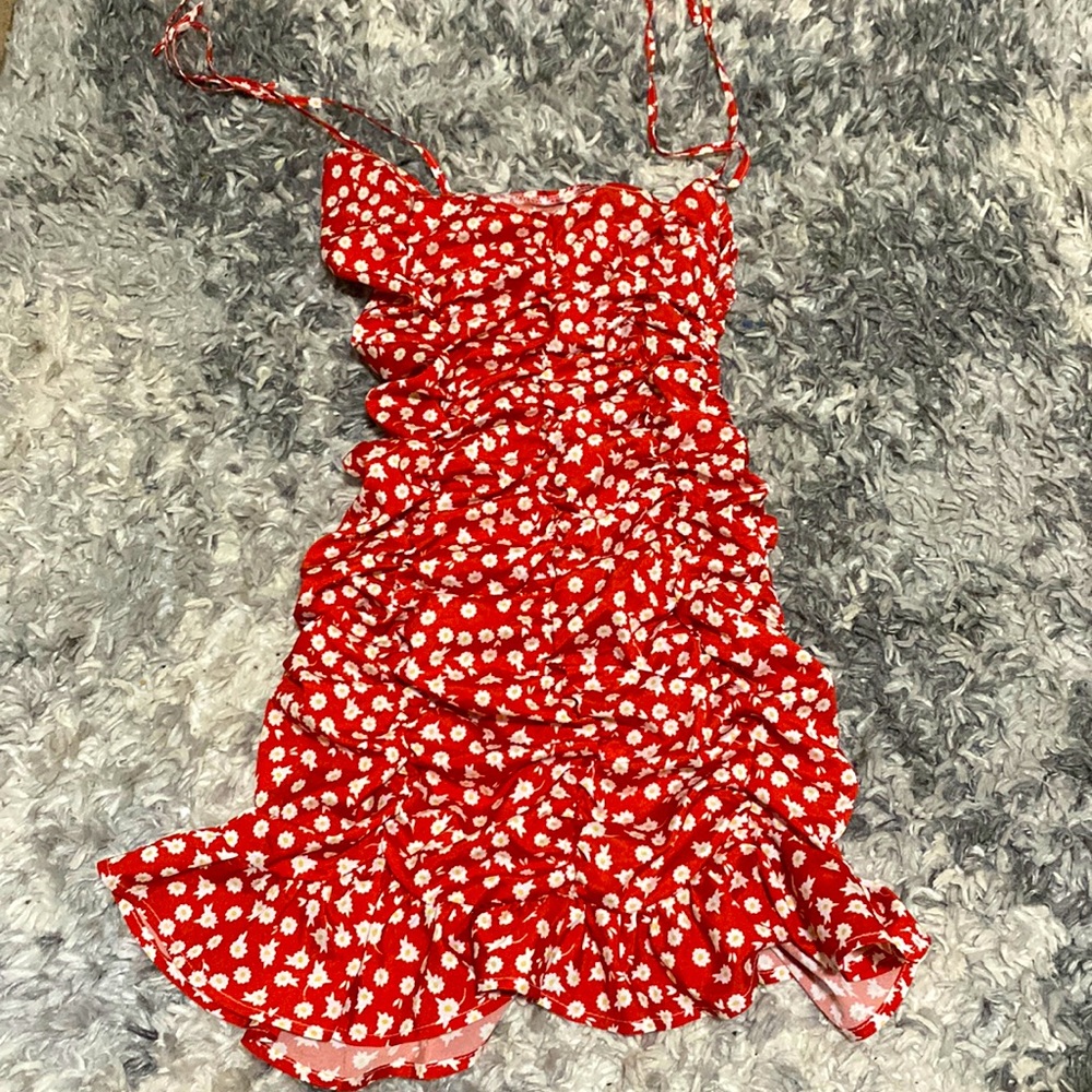 Red ruffled Dress with white and yellow flowers. Very stretchy. Worn once.
